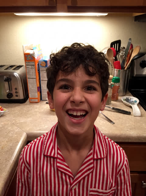 Example photo: boy grinning in a kitchen
