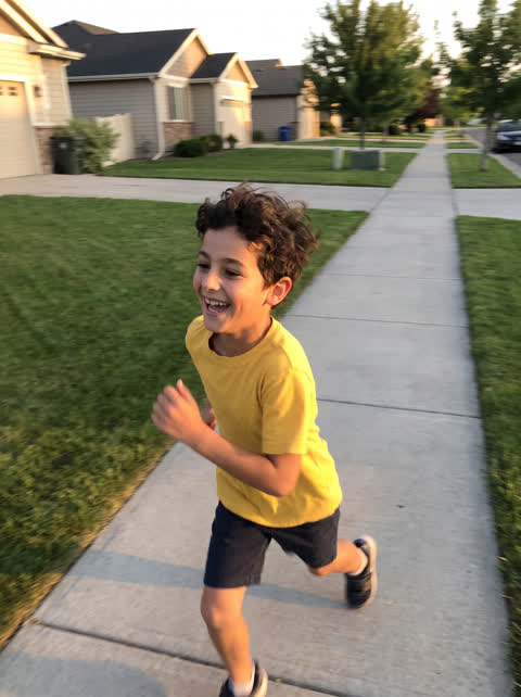 Example photo: boy running outside, slightly blurry